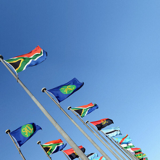 Various hoisted flags of southern African countries lined-up.