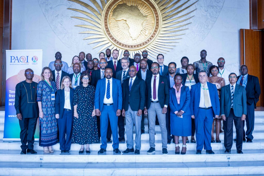 A group of people are standing together for a photograph.