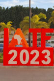 A large red sign with IATF 2023 on it.