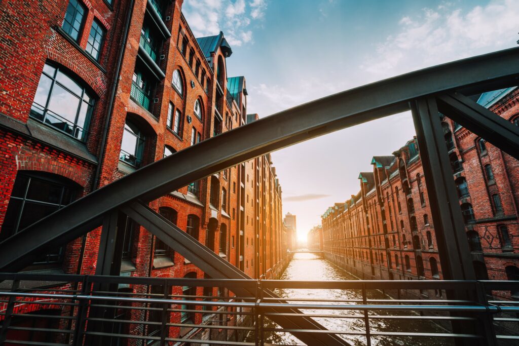 A view of Hamburg's historic Speicherstadt, a warehouse district, through a bridge