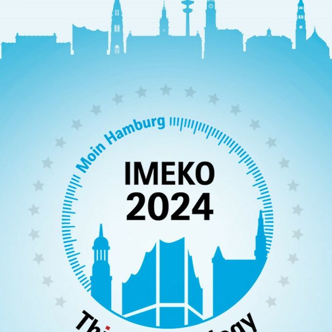 The silhouette of Hamburg landmarks, plus the inscriptions ‘IMEKO 2024’, ‘Think Metrology’ and the slogan ‘Moin Hamburg’ in a circular scale of 25 stars.