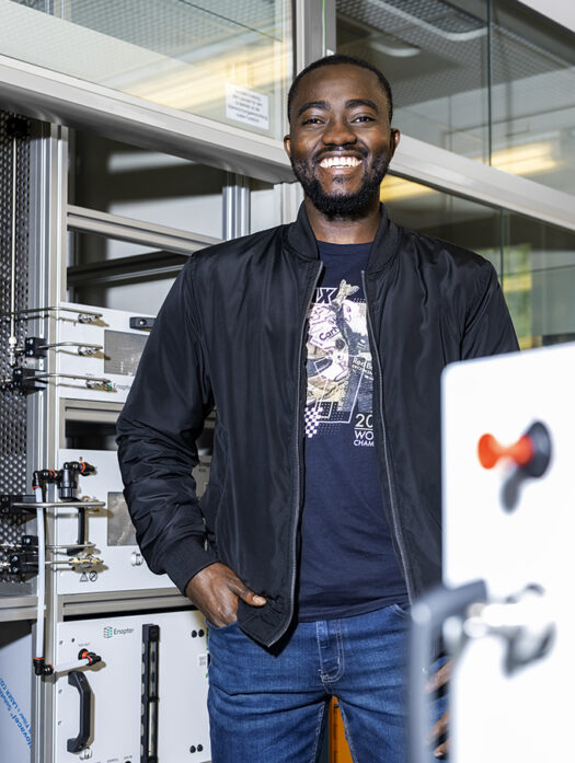 A man is standing in a laboratory