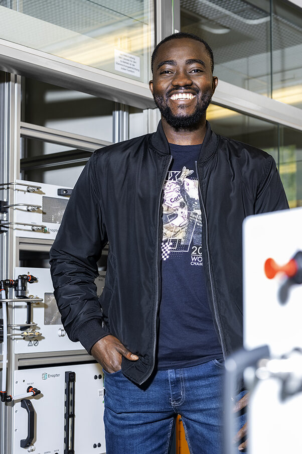 A man is standing in a laboratory