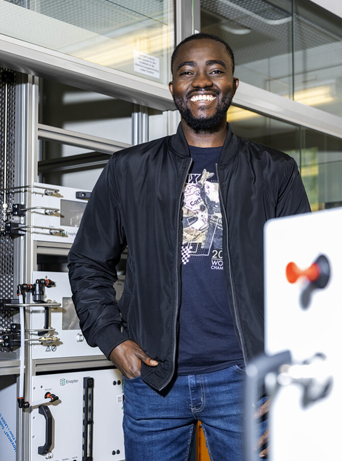 A man is standing in a laboratory