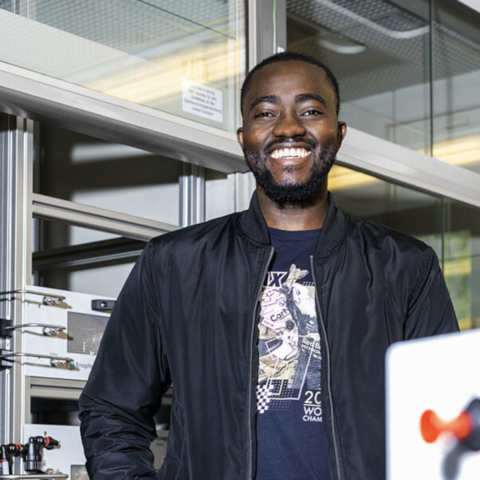 A man is standing in a laboratory