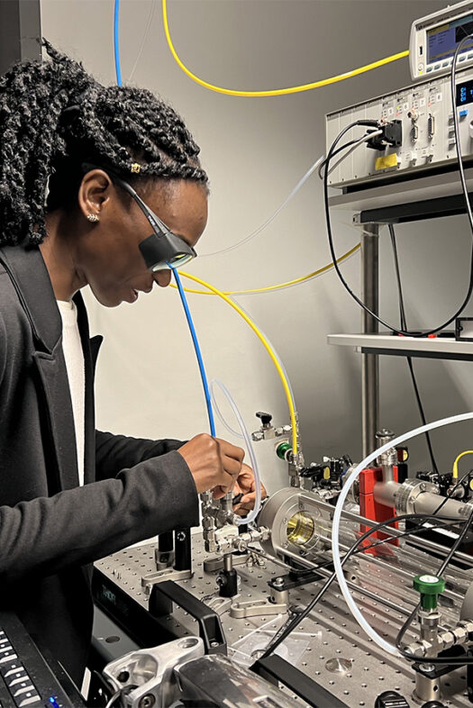 A woman working with high-tech equipment in a modern lab