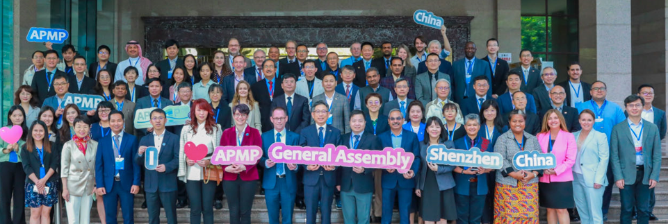 Group photo showing 80 participants of a general assembly)