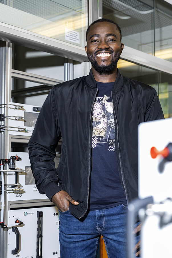 A man is standing in a laboratory