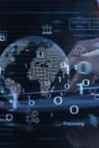 A digital image of a globe with a hand in the background surrounded by data representing the digital transformation