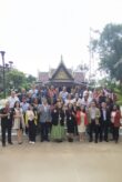 Group photo of the participants of the workshop standing outside a traditional building in Thailand