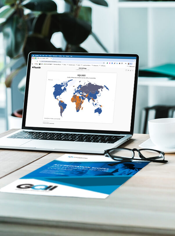 A monitor showing a world map with the overview of the global spread and evolution of quality infrastructure systems.